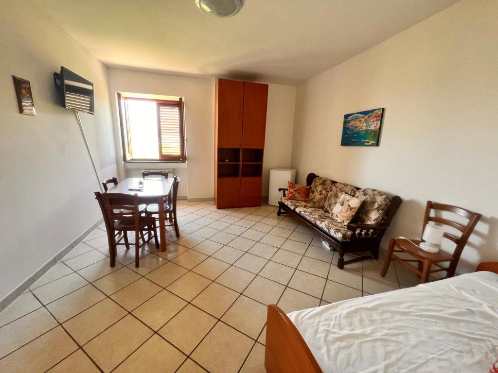 Postel nebo postele na pokoji v ubytování B&b L' Arancio in fiore
