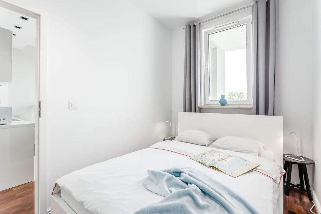 Posteľ alebo postele v izbe v ubytovaní Chill Apartments Mokotow Business Park