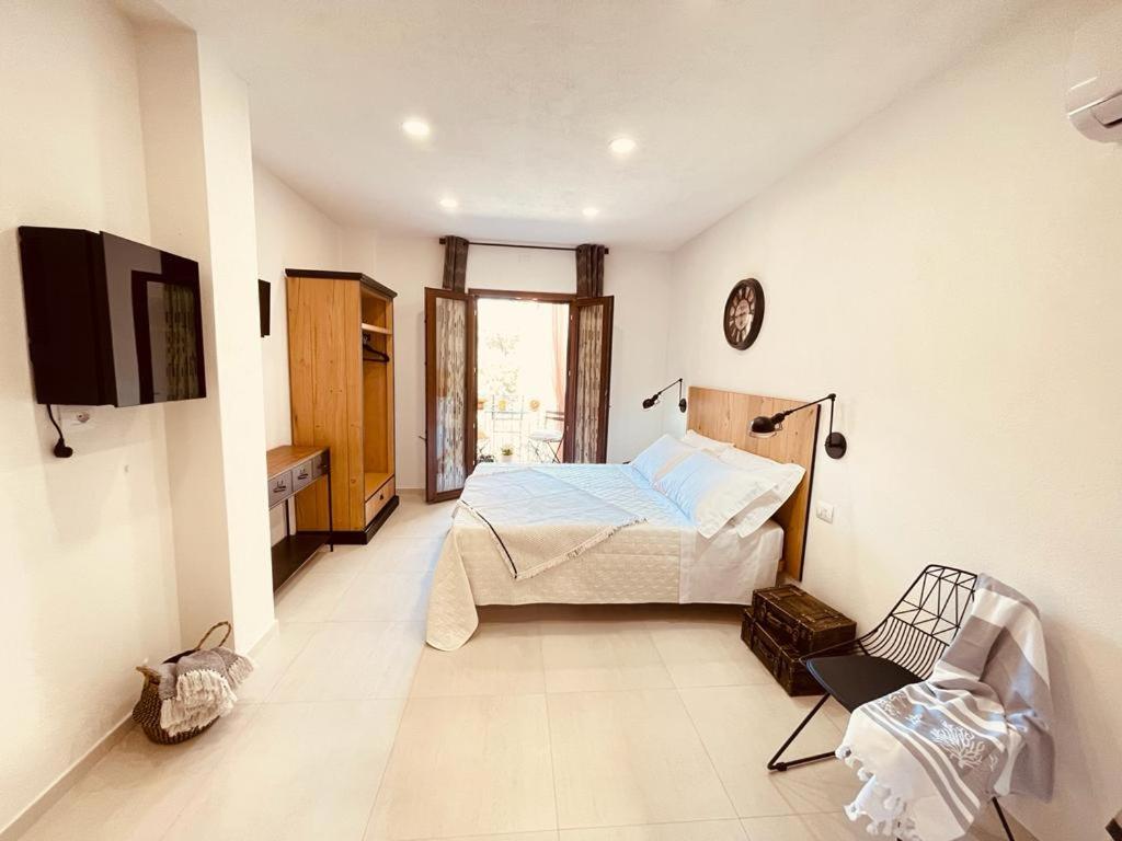 Postel nebo postele na pokoji v ubytování B&B Dimora Dorgali