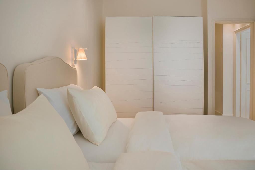 Posteľ alebo postele v izbe v ubytovaní Etoile Luxury Suites