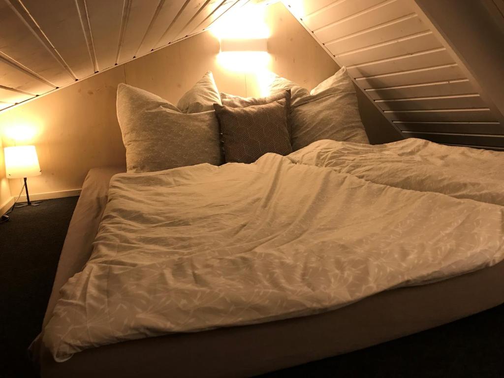 Ein Bett oder Betten in einem Zimmer der Unterkunft TINY LIEBE Ostsee Ostsee- bei Wismar