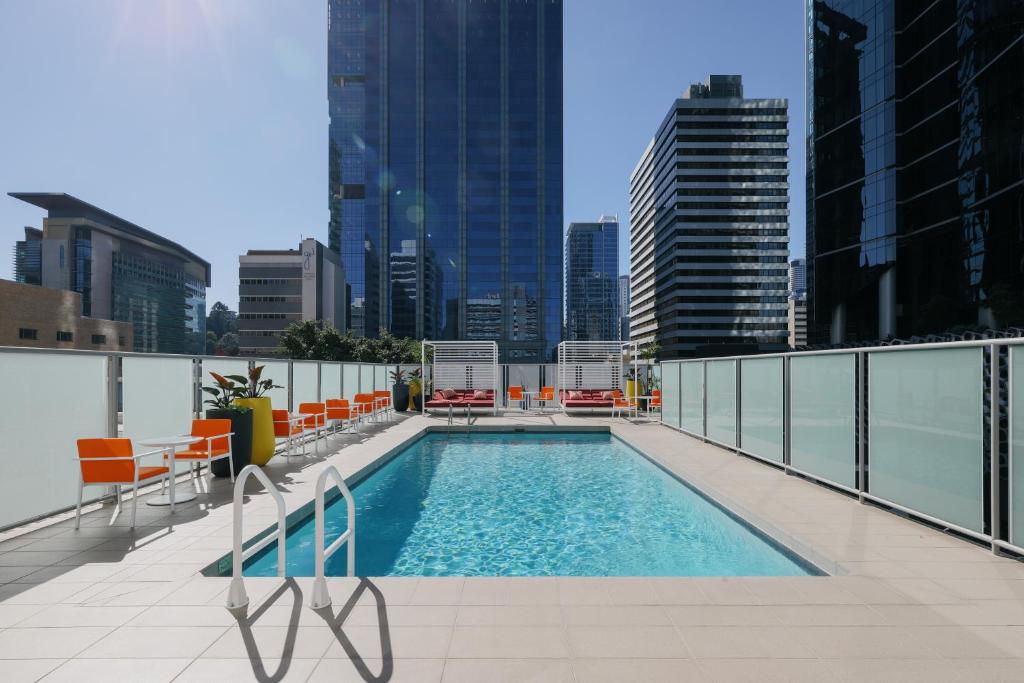 a swimming pool on the roof of a building at voco Brisbane City Centre, an IHG Hotel in Brisbane