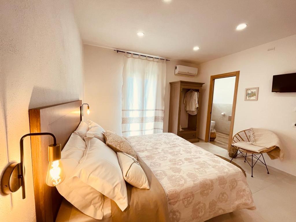 Postel nebo postele na pokoji v ubytování B&B Dimora Dorgali