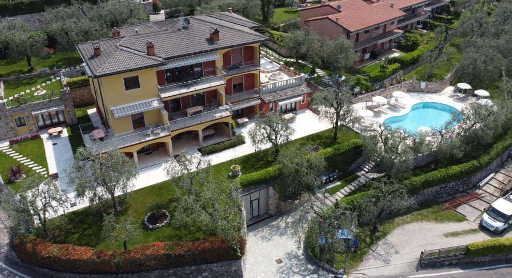 an aerial view of a house with a swimming pool at Villa Due Leoni - Residence in Brenzone sul Garda