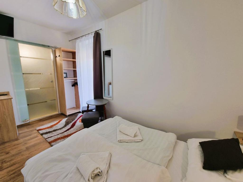 Postel nebo postele na pokoji v ubytování Duna-Beach Apartman