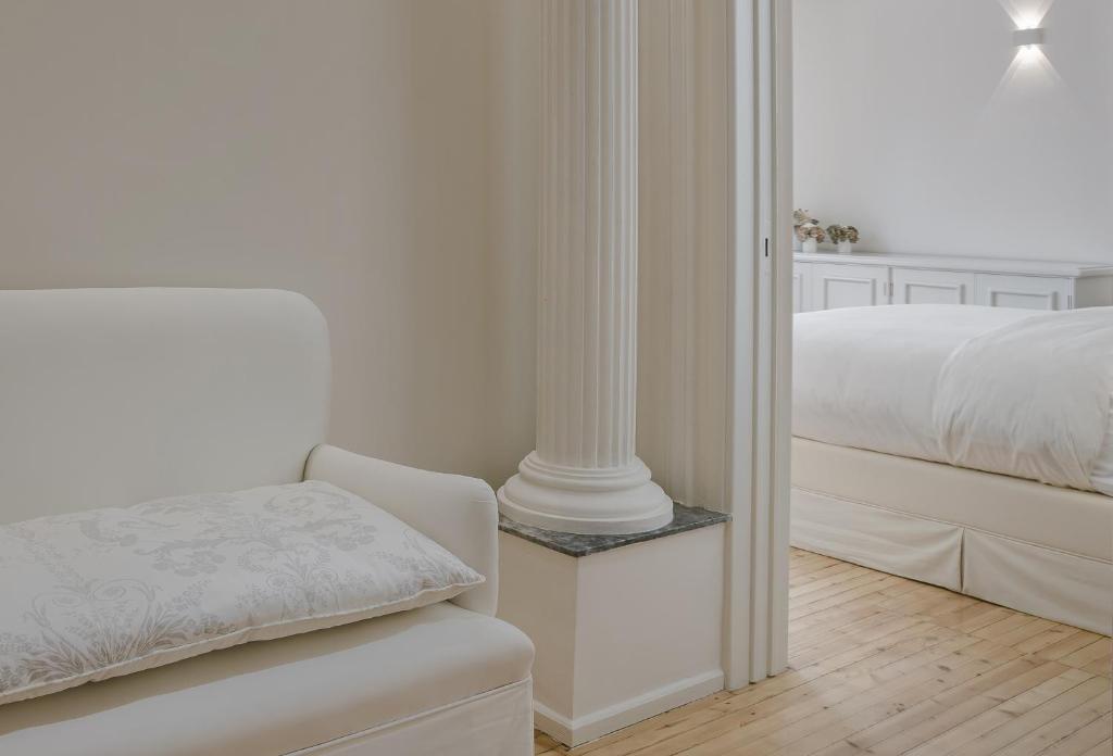 Posteľ alebo postele v izbe v ubytovaní Etoile Luxury Suites