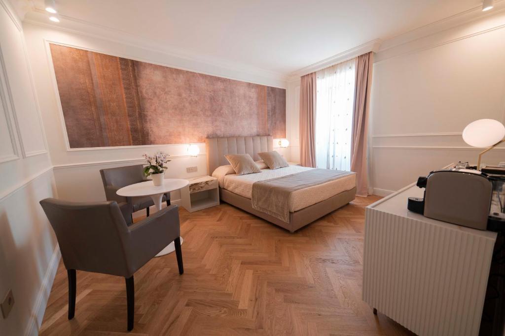 Postel nebo postele na pokoji v ubytování Palazzo Franceschini