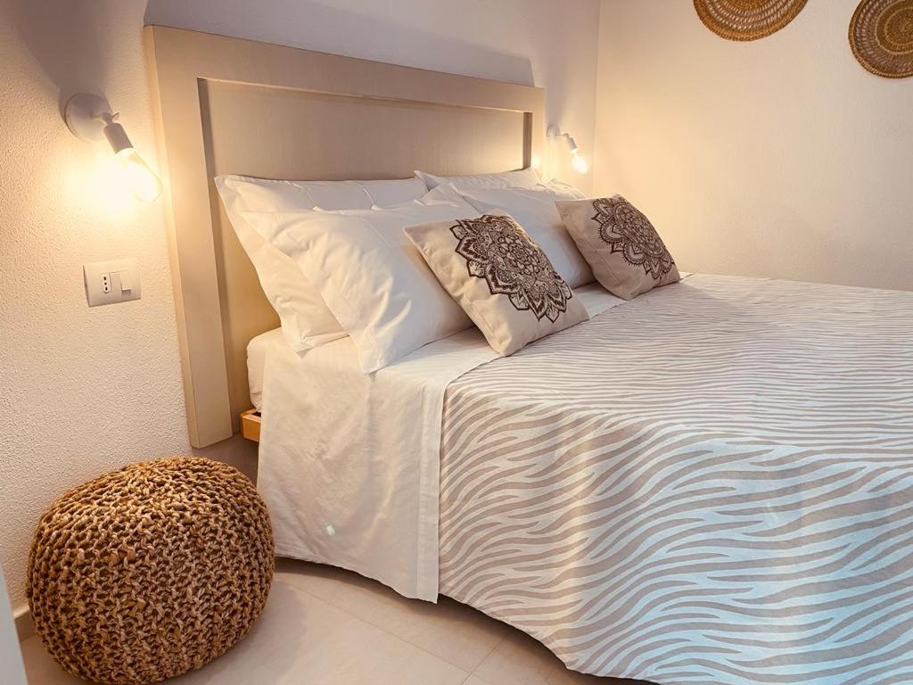 Postel nebo postele na pokoji v ubytování B&B Dimora Dorgali