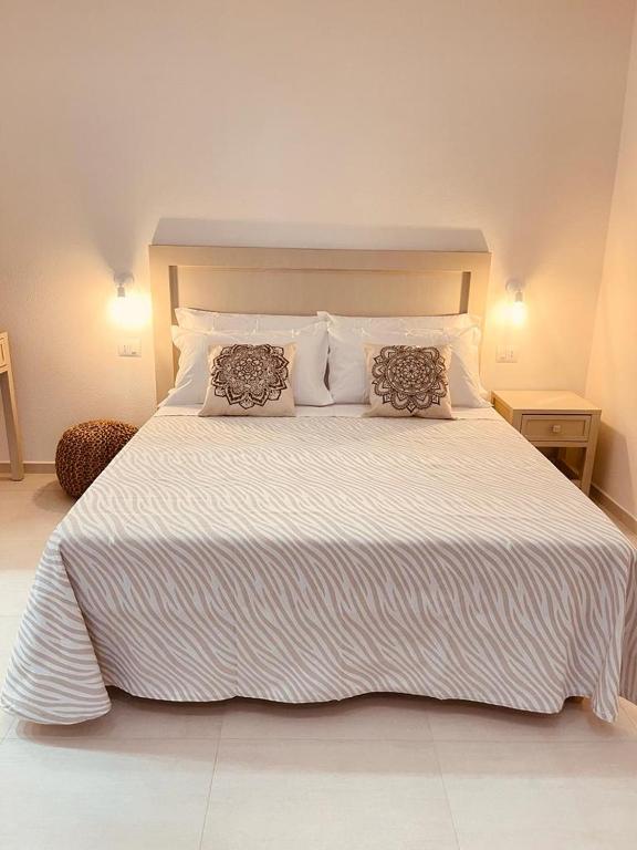 Postel nebo postele na pokoji v ubytování B&B Dimora Dorgali