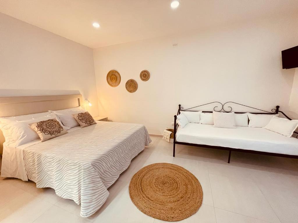 Postel nebo postele na pokoji v ubytování B&B Dimora Dorgali