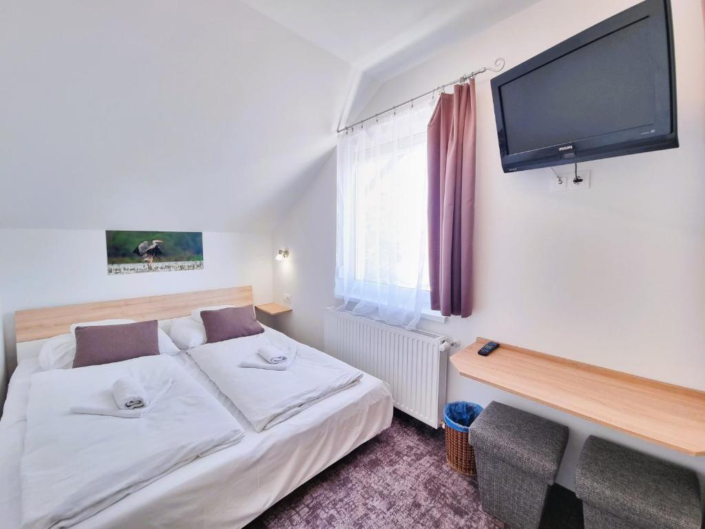 Postel nebo postele na pokoji v ubytování Duna-Beach Apartman