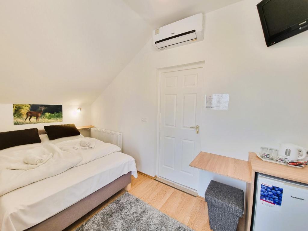 Postel nebo postele na pokoji v ubytování Duna-Beach Apartman