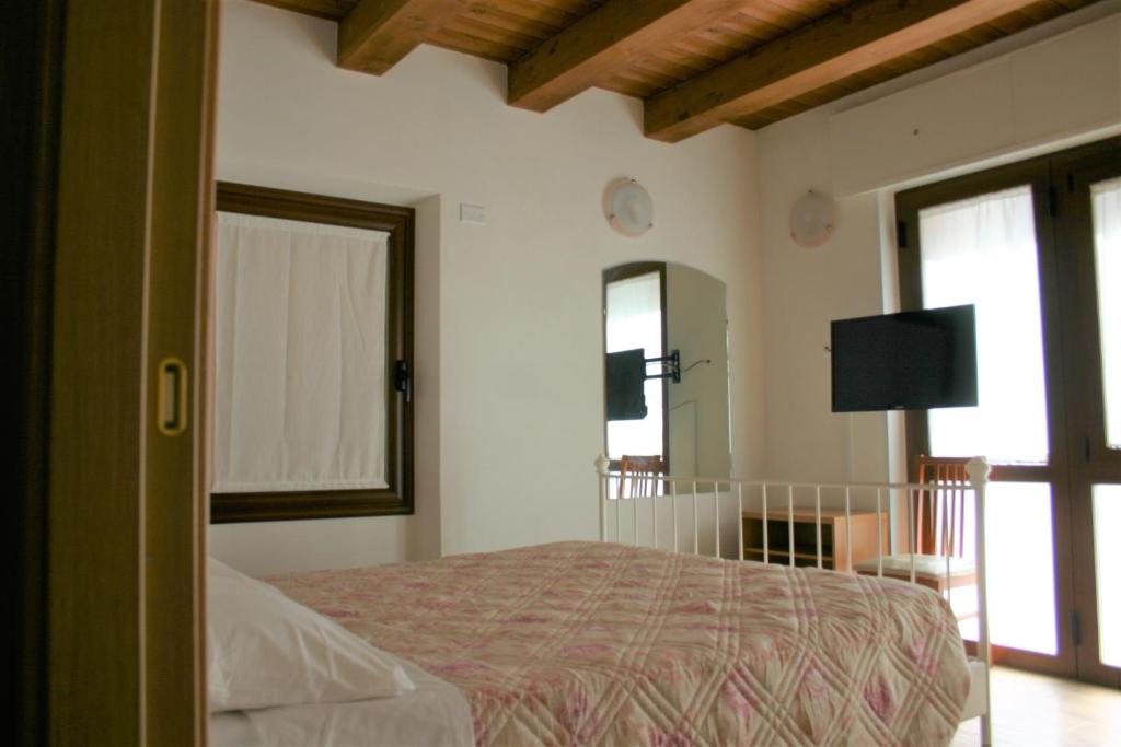Posteľ alebo postele v izbe v ubytovaní A casa di Giò