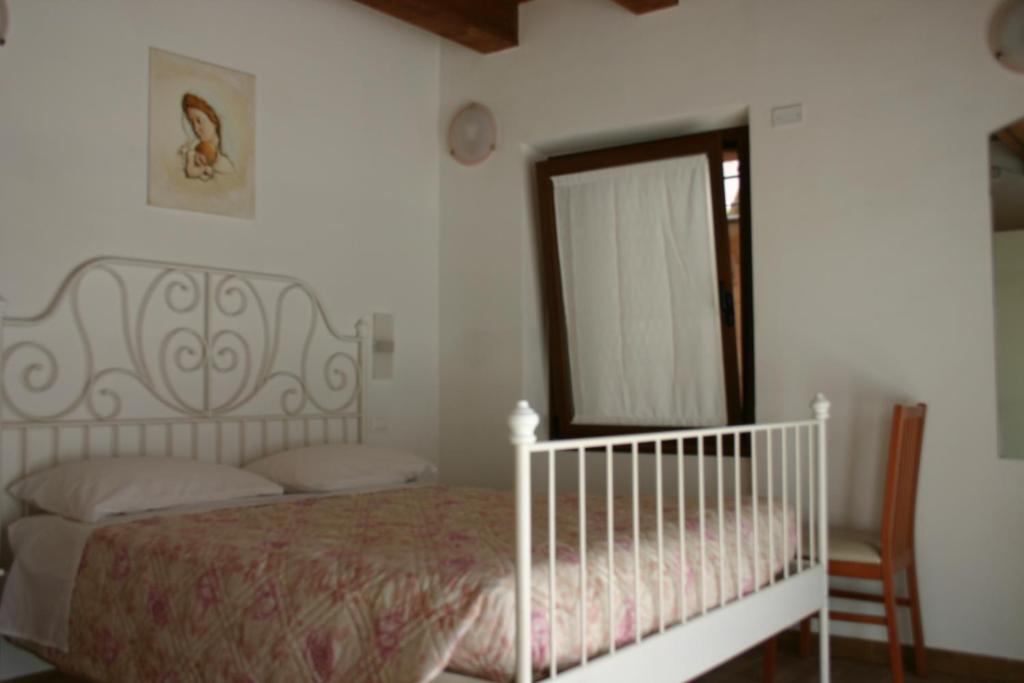 Posteľ alebo postele v izbe v ubytovaní A casa di Giò