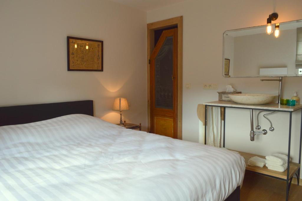 Postel nebo postele na pokoji v ubytování B&B Le Vieux Marronnier