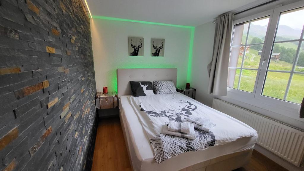 Ένα ή περισσότερα κρεβάτια σε δωμάτιο στο Apartment Di Lembah