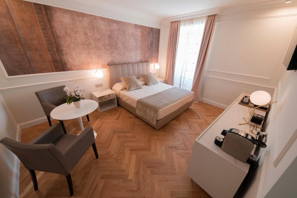 Postel nebo postele na pokoji v ubytování Palazzo Franceschini
