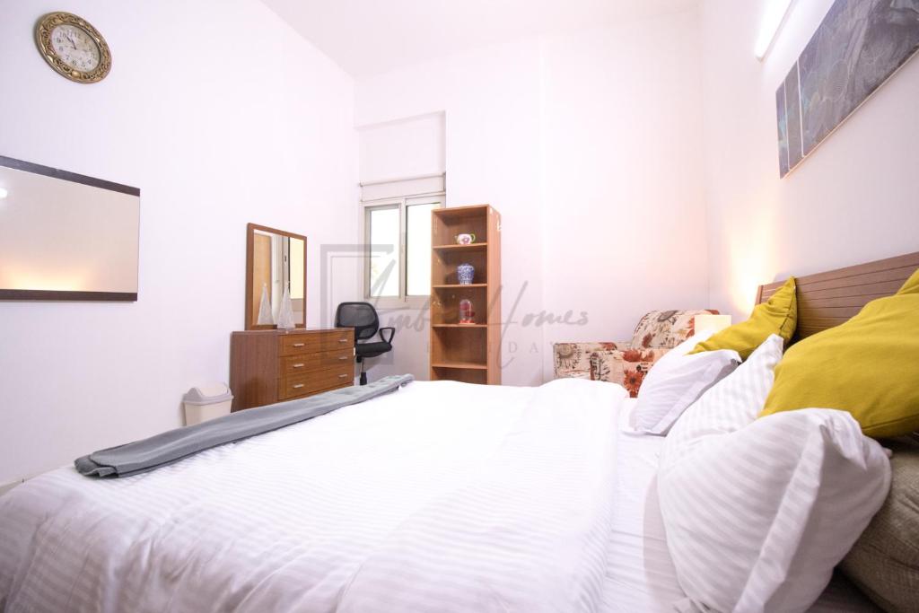 Postel nebo postele na pokoji v ubytování Lovely 2-BR Apartment in Dubai Silicon Oasis Near Global Village