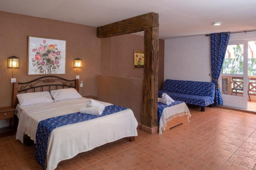 Postel nebo postele na pokoji v ubytování Chez Pepe Apartments