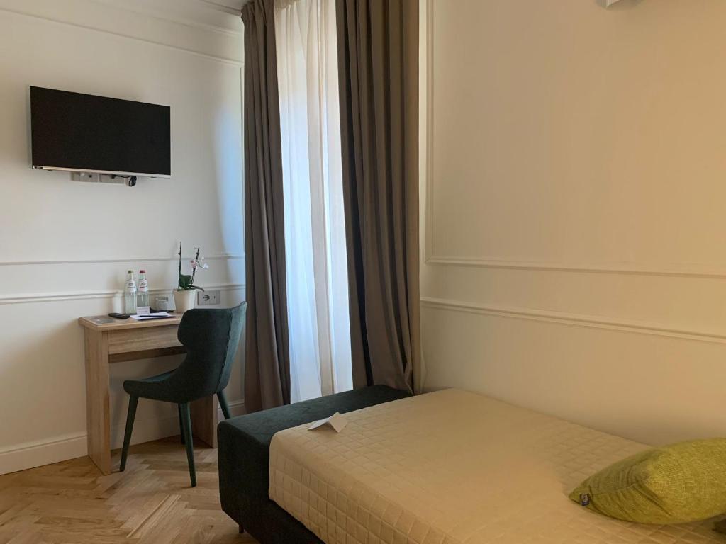 Postel nebo postele na pokoji v ubytování Palazzo Franceschini