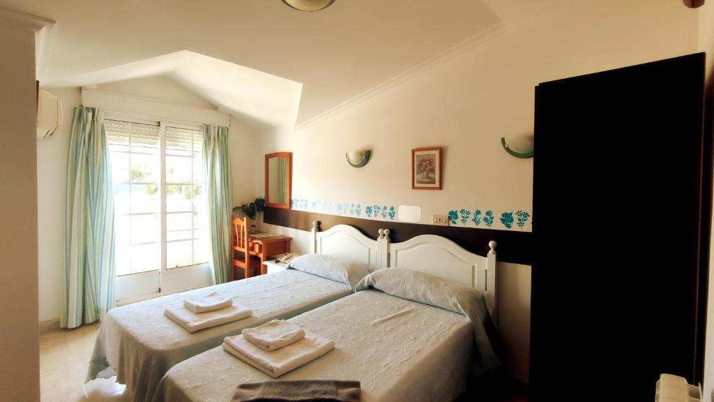 Llit o llits en una habitació de Hotel Baixamar
