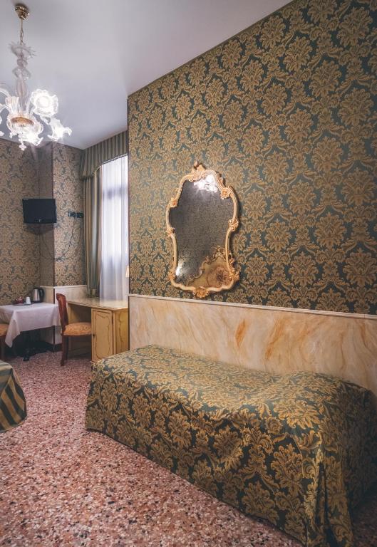 Postel nebo postele na pokoji v ubytování Hotel Al Malcanton