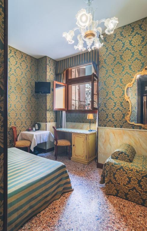 Postel nebo postele na pokoji v ubytování Hotel Al Malcanton