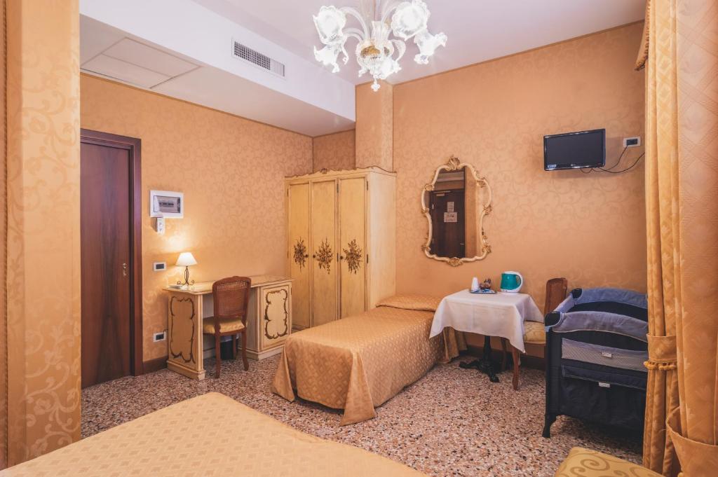 Postel nebo postele na pokoji v ubytování Hotel Al Malcanton