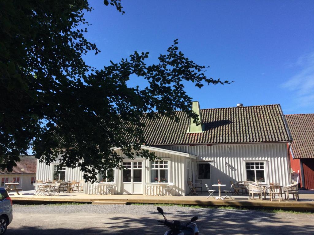 a scooter parked in front of a white building at Hensbacka Herrgård in Munkedal