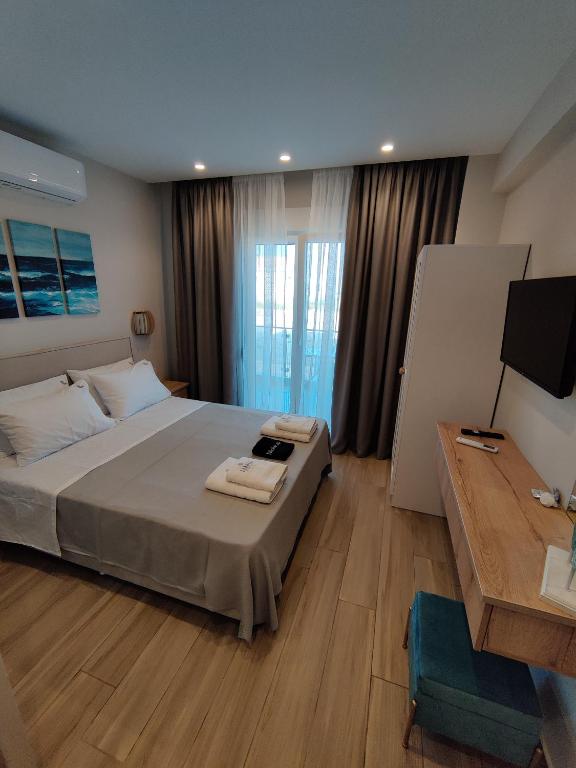 Postel nebo postele na pokoji v ubytování CONMARI LUXURY STUDIOS