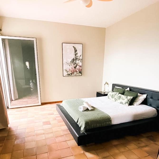 a bedroom with a large bed in a room at Porto Santo Destination in Porto Santo