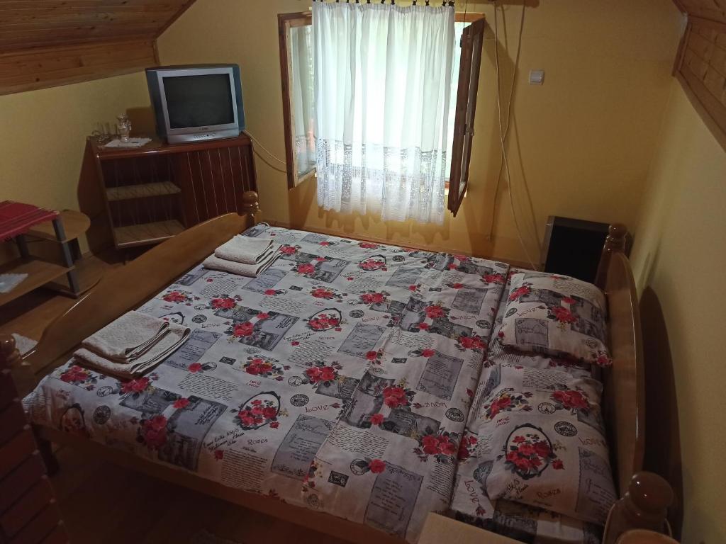 Postel nebo postele na pokoji v ubytování Kod Dace