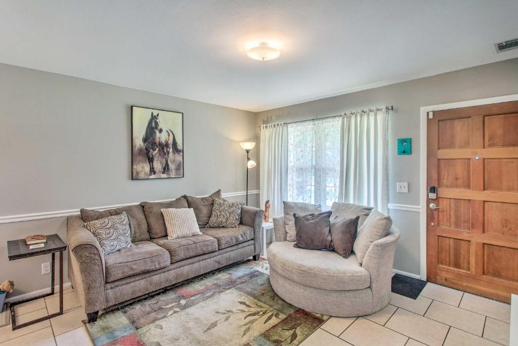 a living room with a couch and a chair at Pet-Friendly Brunswick Retreat with Gas Grill! in Brunswick