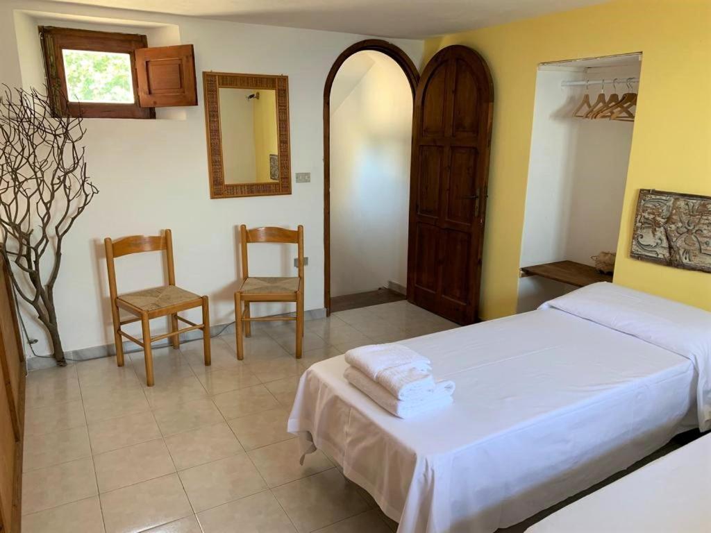 Postel nebo postele na pokoji v ubytování Le case sul lido di Lingua - Isola Salina
