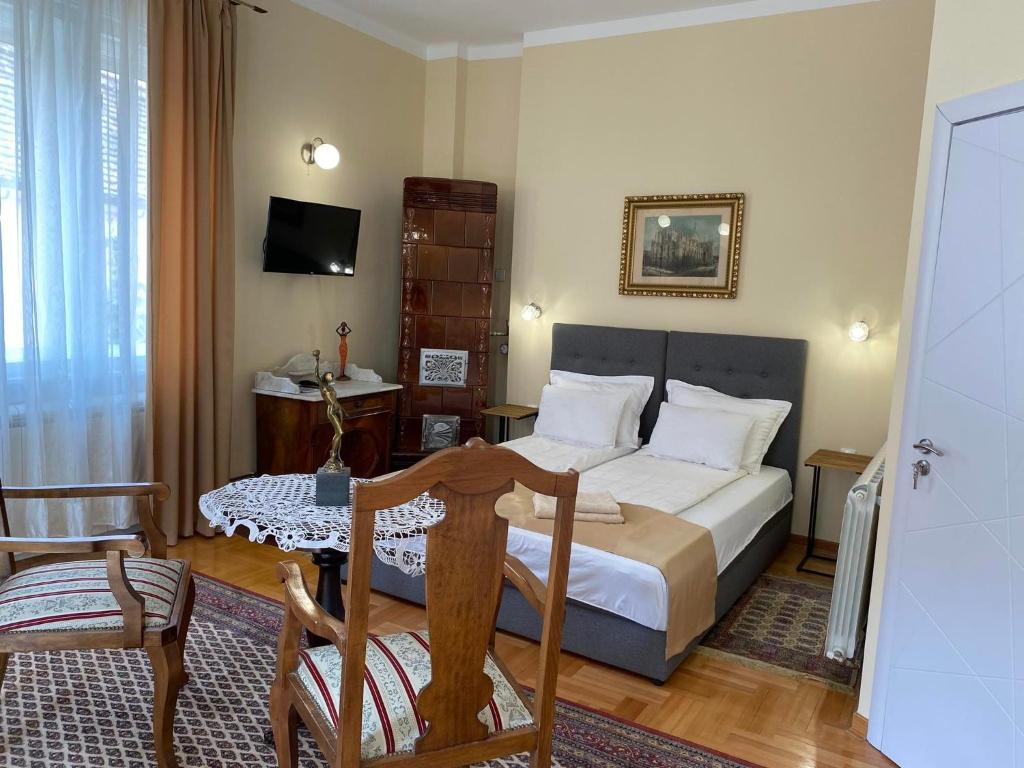 Uma cama ou camas num quarto em Apartman Centar