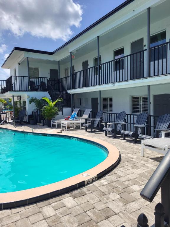 a swimming pool in front of a house at Devon Shores in Clearwater Beach