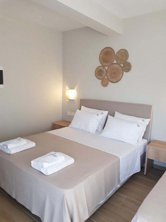 Postel nebo postele na pokoji v ubytování CONMARI LUXURY STUDIOS