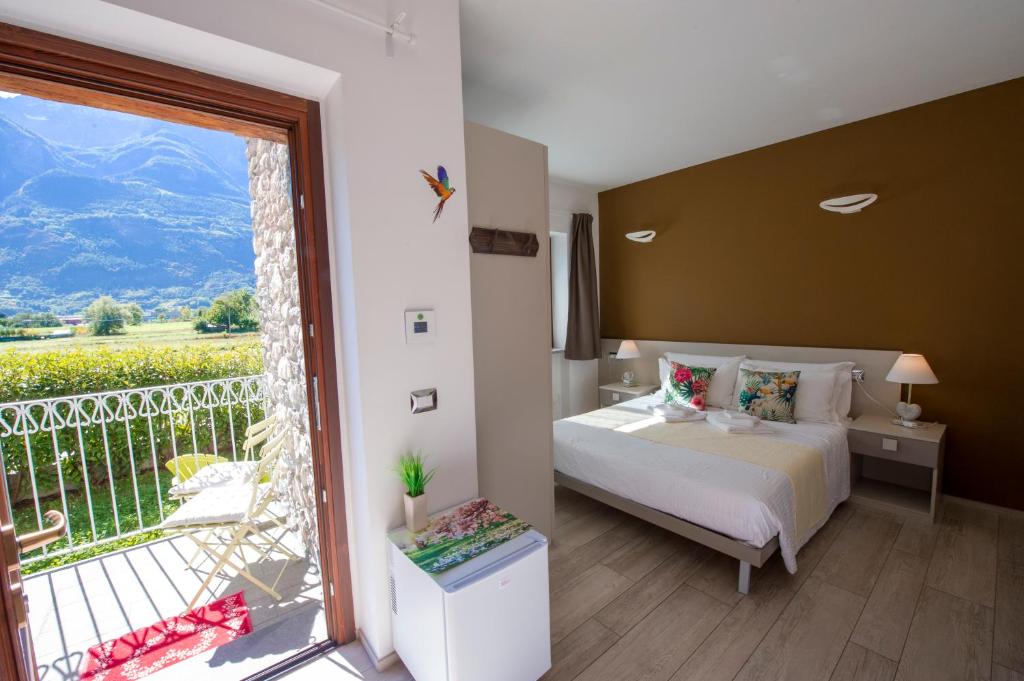 Postel nebo postele na pokoji v ubytování B&B Pousada Rio Aosta-servizi di Bed and breakfast
