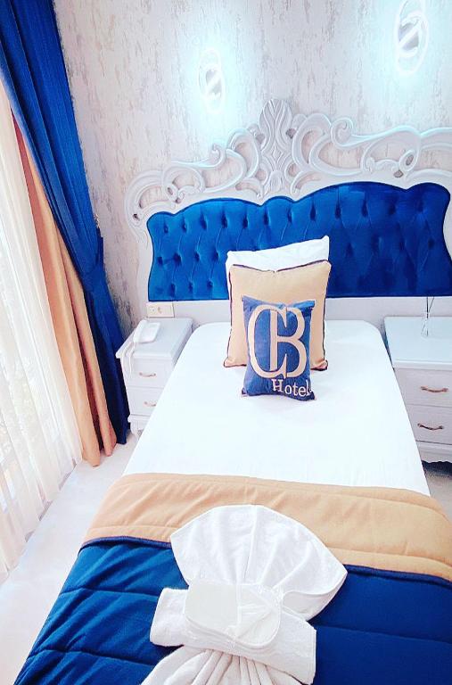 Postel nebo postele na pokoji v ubytování BALPETEK HOTEL