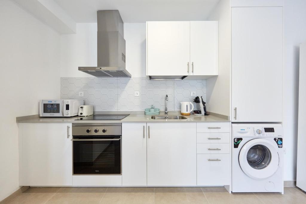 Kuchyň nebo kuchyňský kout v ubytování Sonrisa Deluxe Apartments, Levante