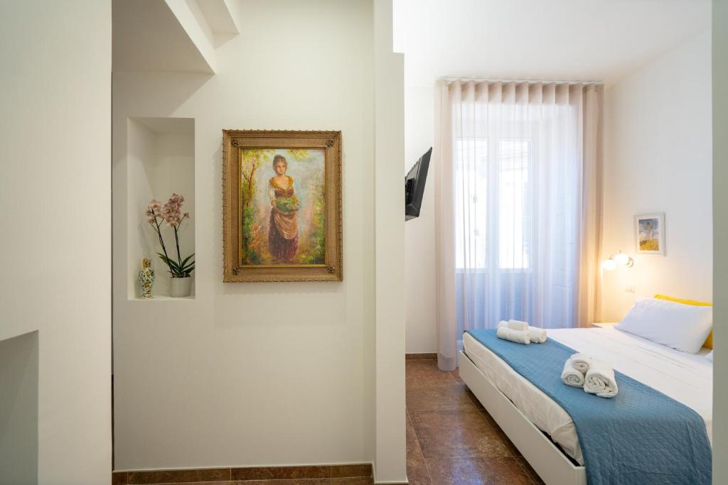 Postel nebo postele na pokoji v ubytování SOGNI DA MARE