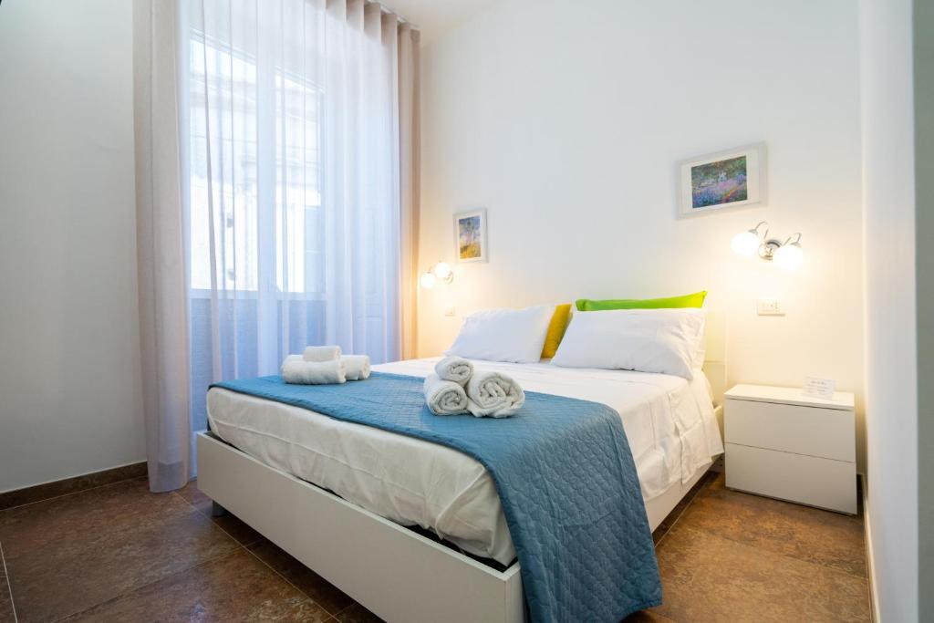 Postel nebo postele na pokoji v ubytování SOGNI DA MARE