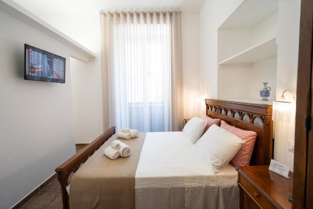 Postel nebo postele na pokoji v ubytování SOGNI DA MARE