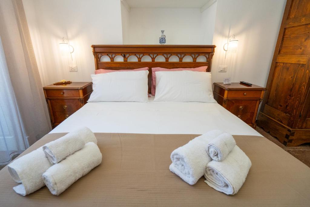 Postel nebo postele na pokoji v ubytování SOGNI DA MARE