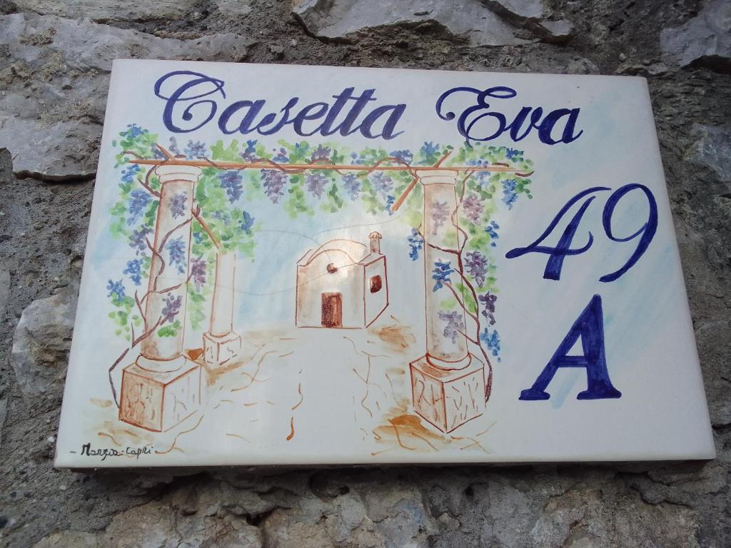een boek met een tekening van een huis bij Casetta Eva in Anacapri