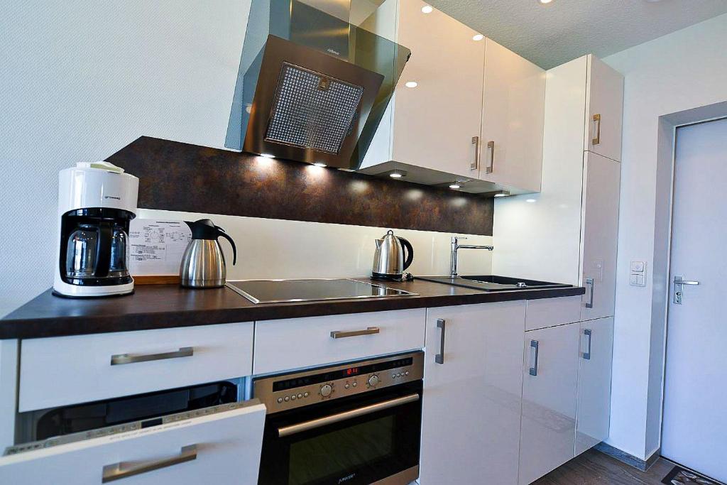 Kuchyň nebo kuchyňský kout v ubytování Haus Frische Brise 1308