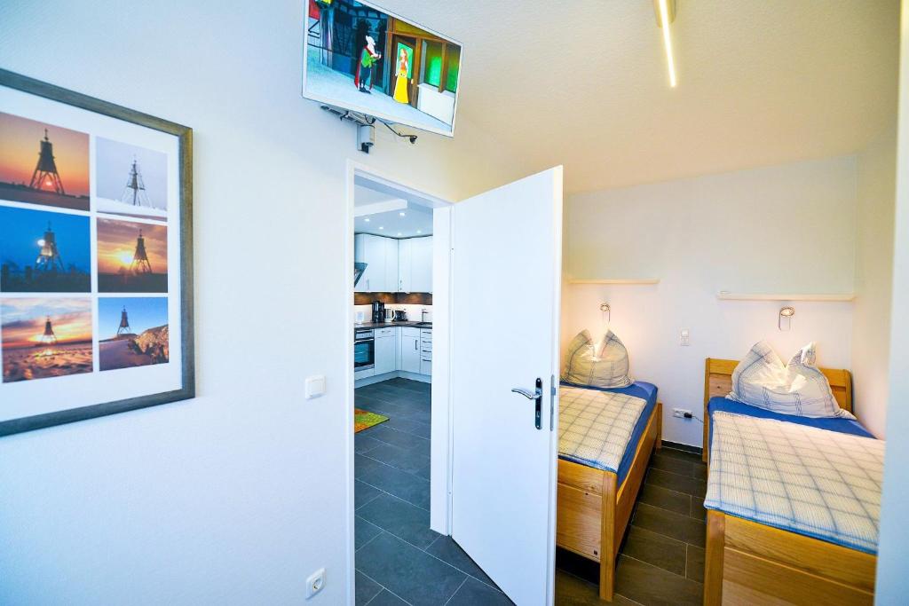 Postel nebo postele na pokoji v ubytování Haus Frische Brise 1409