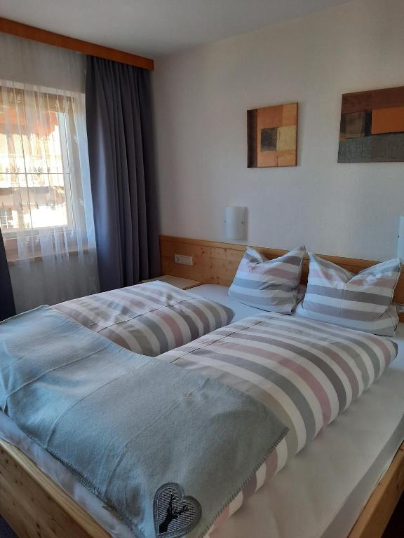 Postel nebo postele na pokoji v ubytování Haus Gmahblick Ferienwonungen
