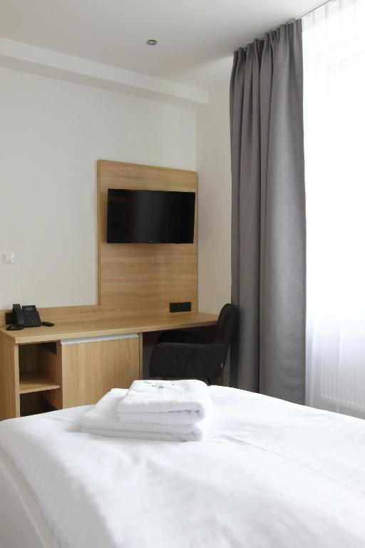 Televízia a/alebo spoločenská miestnosť v ubytovaní Typton hotel&spa