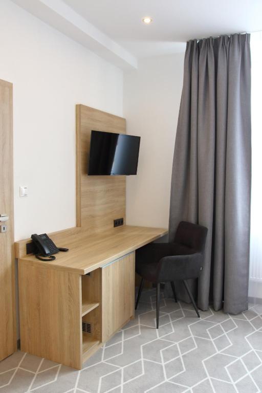 Televízia a/alebo spoločenská miestnosť v ubytovaní Typton hotel&spa
